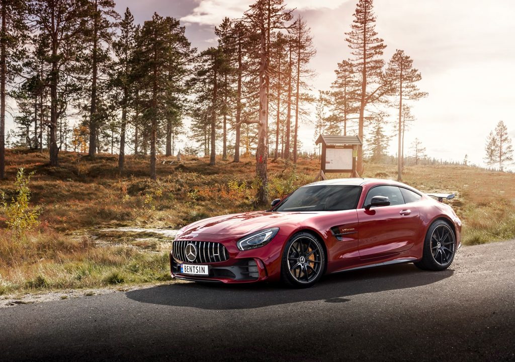 mercedes specialists - red mercedes parked in rural area - side view